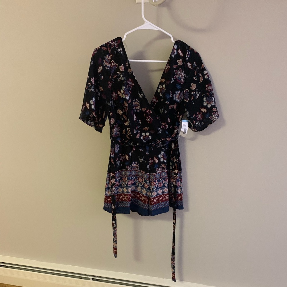 New with tags romper. Never worn